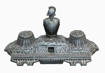 a statue of a man sitting on top of a boat
