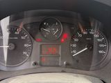 a close up of a car dashboard with a clock on it