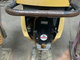 a yellow machine that is sitting on the ground