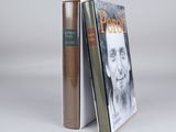 two books sitting next to each other on top of a table