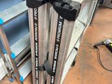 two metal ladders that are sitting on the floor