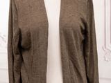 a close up of a mannequin mannequin wearing a brown cardigan