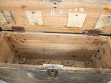 a wooden chest with a metal latch on it