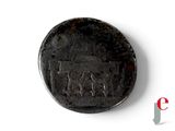 an old coin with a picture of a man and a horse on it