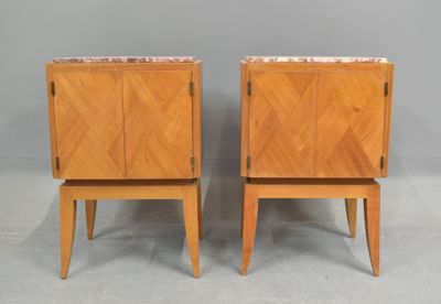 a pair of mid century style nightstands with marble top