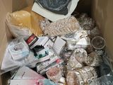 a cardboard box filled with assorted items in it