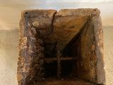a small hole in the floor that has been dug in