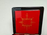 a red box with a gold design on it