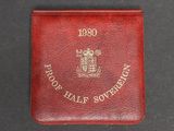an image of a red leather wallet with a gold emblem on it