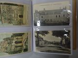 a person holding a book with pictures of buildings on it
