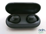 a pair of black earphones in a black case