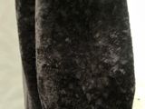 a close up of a person wearing a black coat