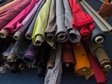 many different colored umbrellas on display in a store