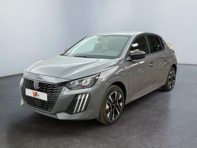a grey car is parked in a large room with a black floor