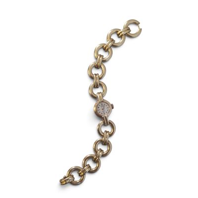 un gros plan d'un bracelet en or orné d'un diamant
