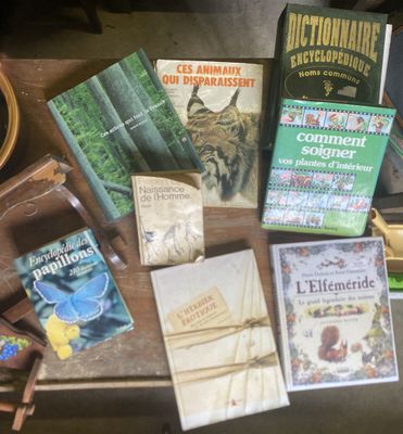 many books on a table with a cup of coffee