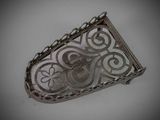 an image of a silver plate with a decorative design on it