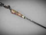 an image of a knife with a chain on it