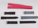 several different types of watches are laid out on a white surface