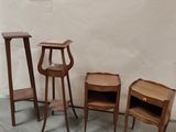 several pieces of furniture sitting on a cement floor next to a white wall