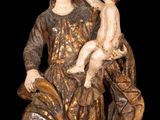 an image of a statue of a woman holding a child