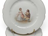 a plate with a picture of two children on it