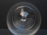 a blurry image of a glass of water on a table