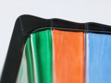 a close up view of a multicolored glass vase