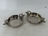 a pair of silver plated sugar and pepper shakers