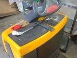a yellow and black table with a steering wheel on it