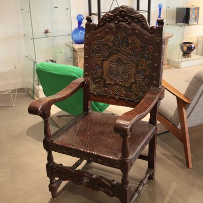 a wooden chair that is sitting in a room