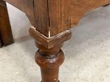 a wooden table with a drawer on top of it