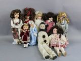 a lot of dolls that are sitting together on a table