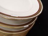 several plates stacked on top of each other on a black surface