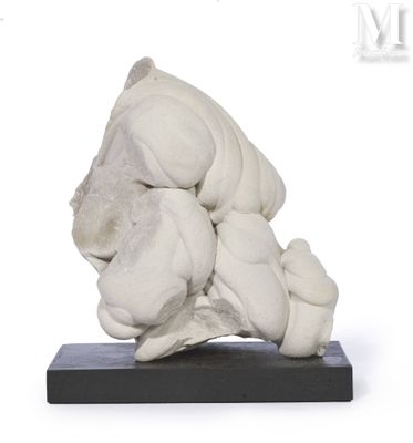 a white sculpture of a dog on a black base