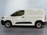 the white van is parked in a room with a gray floor