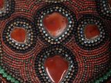 an image of a close up of a beaded necklace on a mannequin