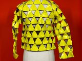 a mannequin mannequin with a yellow jacket on it
