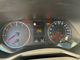 a close up of a car dashboard with a speedometer and gauges