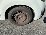 a white car that has a flat tire on it