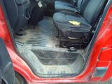 a suitcase sitting in the back of a red car