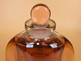 a bottle of perfume sitting on a table