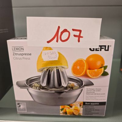 a box with a juicer sitting on a counter