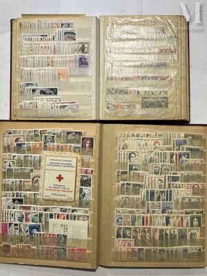 three open books with stamps on them sitting on top of a table