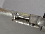 a close up of a gun that is on a table