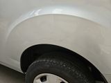 a white car that is parked on the side of the road