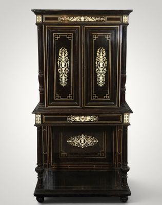 a black and gold painted cabinet with two doors and drawers