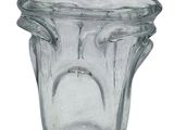 a clear glass vase with a face on it
