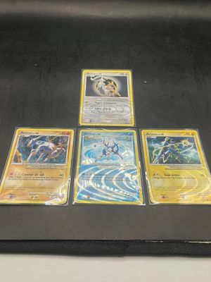 a lot of pokemon cards on a black table