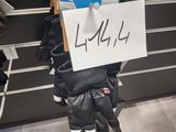 a sign on the back of a pair of gloves